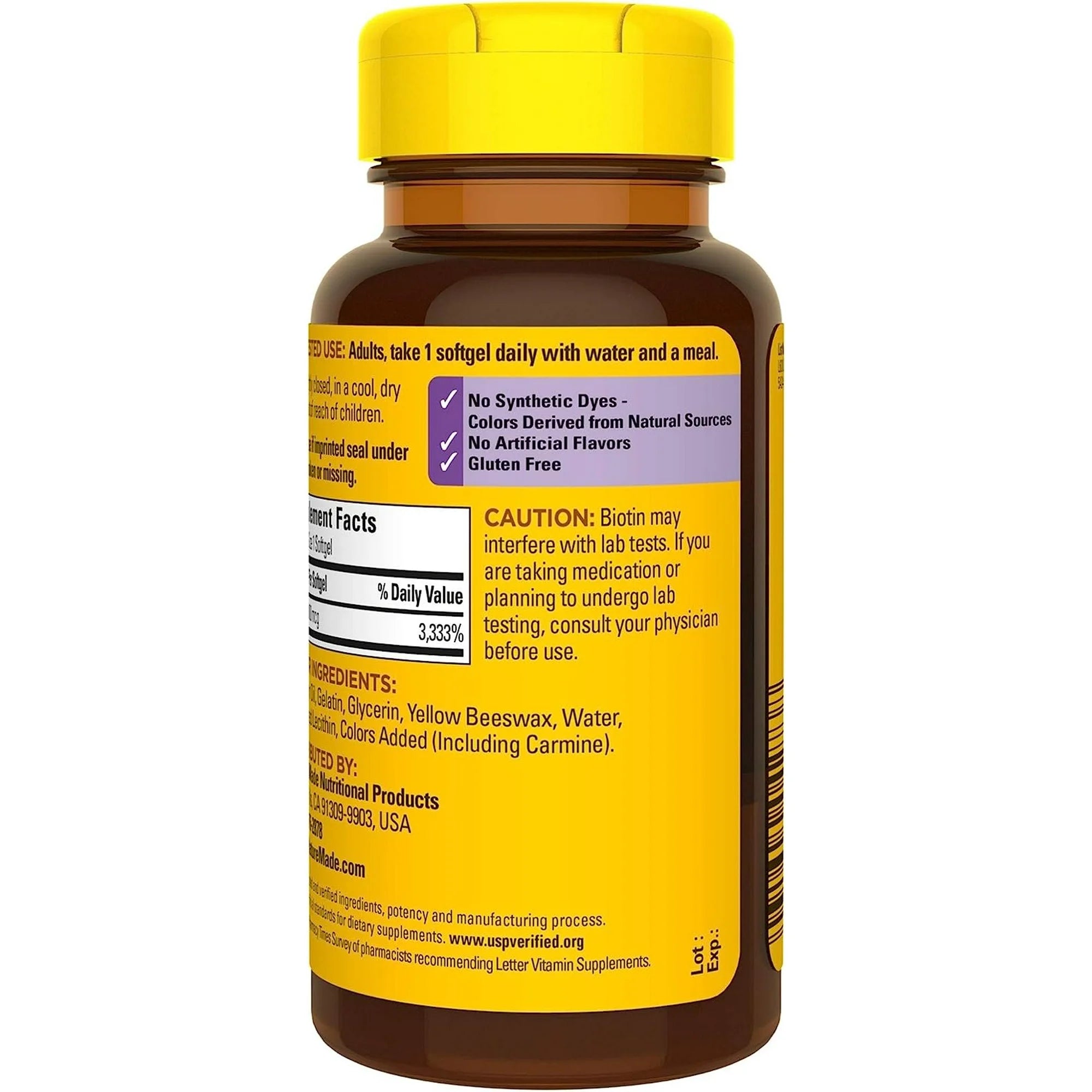 Vitamin supplement bottle with yellow cap and label on a white background. Biotin supplement for healthy hair, skin, and nails