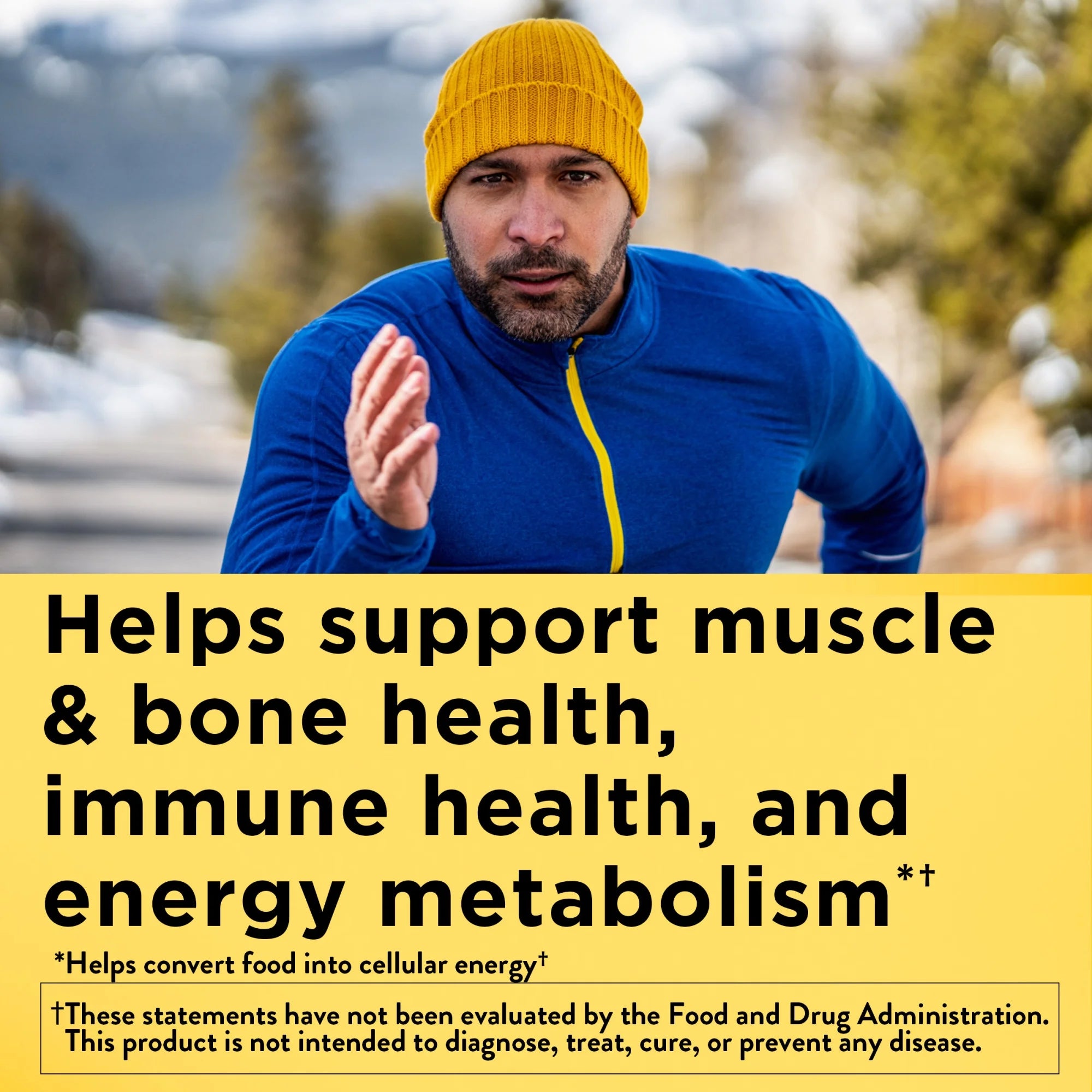 Person in blue jacket and yellow beanie outdoors with health benefits text overlay. Men’s daily multivitamin gummies Nature Made mixed berry and cherry