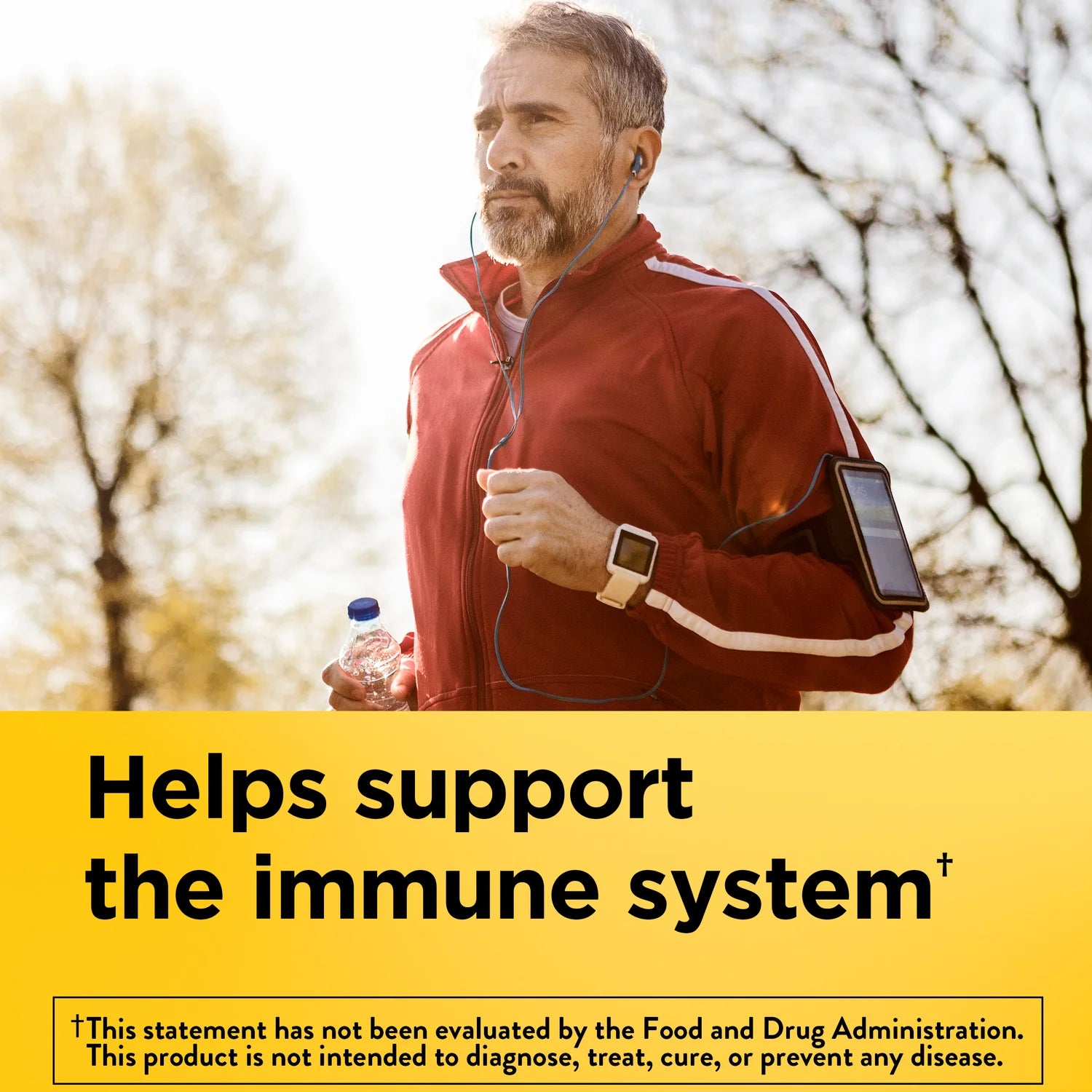 Man jogging outdoors with text about supporting the immune system. Nature Made B-complex vitamin energy and immune support caplets